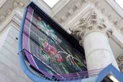 Part of the massive metal chain screen featuring a traditional floral Métis beadwork design (Ruth Bonneville / Free Press)