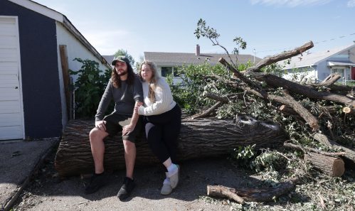 Ruth Bonneville / Free Press

 LOCAL - River Heights tornado

Photo of Lindsay street resident Tanner Lemieux with his wife Cassidy Lemieux, in the back yard where huge trees were thrown around during Sunday’s storm.  

Story: It was confirmed today that a tornado touched down during a wild storm in River Heights Sunday night. Tanner Lemieux, whose door camera footage helped the northern tornadoes project nail down the time of the storm. He made it into his house minutes before his neighbour's car flipped due to the heavy winds.

See story by Malak 

Sept 10th,   2026