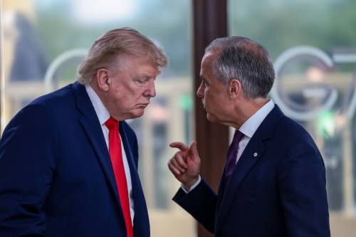 THE ASSOCIATED PRESS FILES
                                U.S. President Donald Trump speaks with Canadian Prime Minister Mark Carney (right) at a working lunch with leaders of G7 and the Middle East in Evian-les-Bains, France in June.