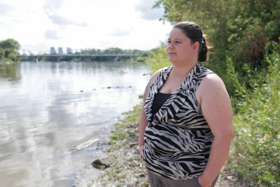 Jayclyn Morrissette on the banks of the Red River near where she rescued a two-year-old girl and her dad from drowning last week. (Ruth Bonneville / Free Press)