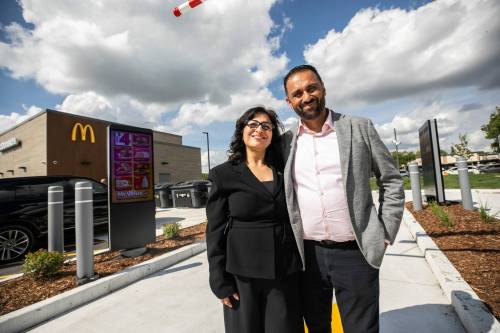MIKAELA MACKENZIE / FREE PRESS 	 Amit Kapoor, operator/franchisee of the first drive-thru-only McDonald's restaurant in Canada, with his wife Bharti Kapoor at the Kenaston location on Wednesday, Sept. 2, 2026. For Aaron Epp story. Free Press 2026