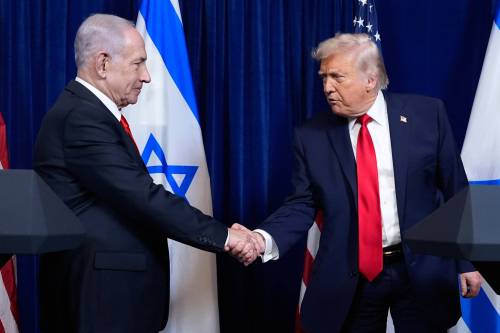 the Associated Press Files
                                U.S. President Donald Trump shakes hands with Israel&rsquo;s Prime Minister Benjamin Netanyahu in December 2025.