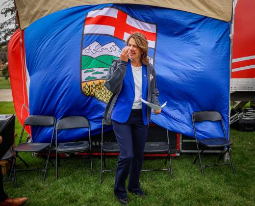 Jeff McIntosh / the Canadian press files
                                Alberta Premier Danielle Smith waits to deliver a speech at an Alberta Day event in Calgary.