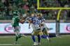 Saskatchewan Roughriders receiver Dhel Duncan-Busby (18) catches the ball as Winnipeg Blue Bombers defensive back Ridge Texada (26) and teammate Evan Holm (31) run to tackle during second half CFL action in Regina on Sunday, Sep. 6, 2026. THE CANADIAN PRESS/Kayle Neis
