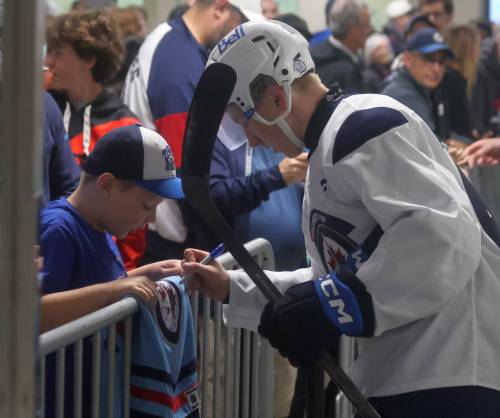 CASSIDY DANKOCHIK / THE CARILLON
                                Winnipeg Jets forward Viggo Bjorck signs autographs at Jets development camp earlier this summer.