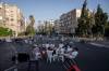 Oded Balilty / The Associated Press files
                                Israeli youths sit at a junction on a car-free road in 2023 during the Jewish holiday of Yom Kippur in Ramat Gan, Israel. Israel comes to an almost complete standstill on Yom Kippur.