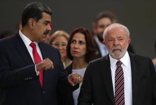 AP Photo/Gustavo Moreno
                                Brazilian President Luiz Inacio Lula da Silva, right, speaking with Venezuela&rsquo;s President Nicolas Maduro, with a translator standing between them. Lula is facing a tightening race as he seeks a fourth term leading Brazil.