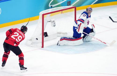 Darryl Dyck / THE CANADIAN PRESS FILES
                                Team Canada&rsquo;s Nathan MacKinnon (left) just misses the open net on Team USA netminder Connor Hellebuyck in the men&rsquo;s gold medal hockey game at the 2026 Milan Cortina Olympics back in February.