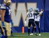 JOHN WOODS / THE CANADIAN PRESS
                                Toronto Argonauts&rsquo; Janarion Grant (3) and Alexander Teubner (33) celebrate Grant&rsquo;s touchdown after returning Winnipeg Blue Bombers&rsquo; failed field goal attempt during the first half CFL in Winnipeg on Friday.