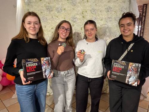 AARON EPP / FREE PRESS 

Romane Ridel, Elina Vieillard, Jade Dumesnil and Janel Khouildi are four of the students from France who were presented with regimental coins from the Queen’s Own Cameron Highlanders of Canada in Winnipeg on Saturday.