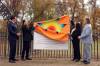 Tim Smith/The Brandon Sun
                                Manitoba Premier Wab Kinew, Manitoba Keewatinowi Okimakanak Grand Chief Garrison Settee, Sioux Valley Dakota Nation Chief Jennifer Bone and Brandon Mayor Jeff Fawcett remove a star blanket to unveil a sign at the Brandon Residential School Cemetery at the former Turtle Crossing Campground, Tuesday.