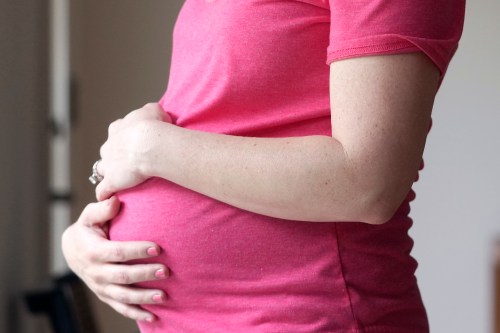 A pregnant woman stands for a portrait in Dallas on Thursday, May 18, 2023. THE CANADIAN PRESS/AP-LM Otero