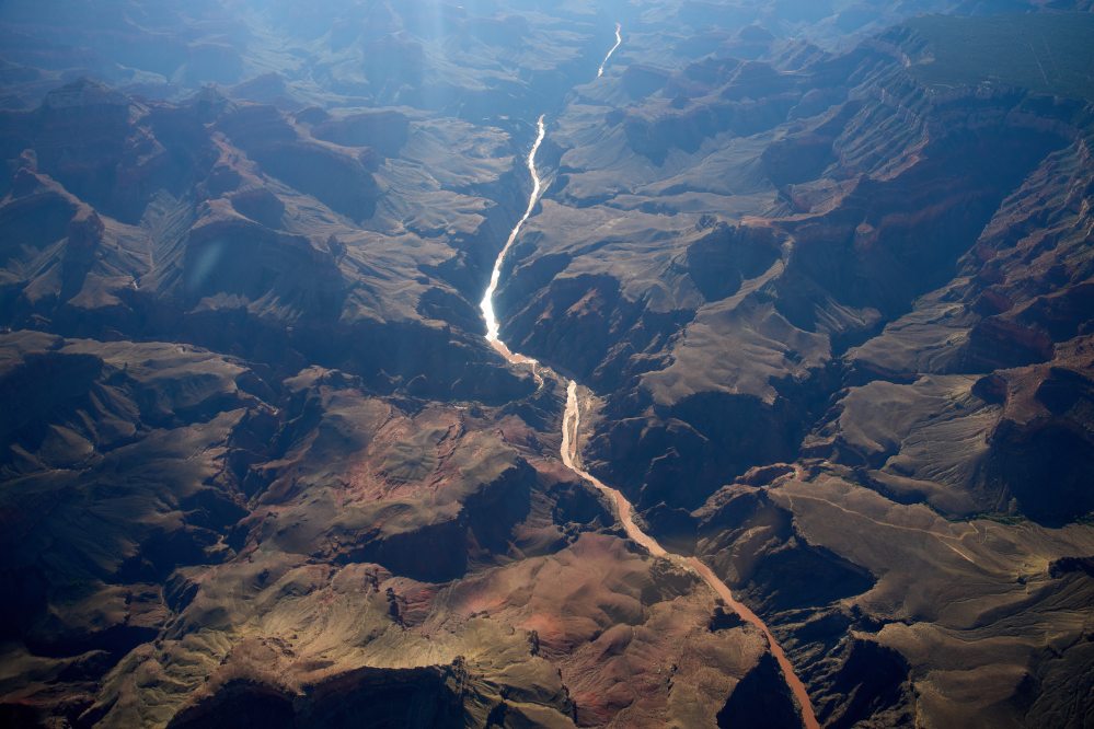 Bright Angel Canyon, center left, a flash flood site, meets the Colorado River at the Grand Canyon on Monday, Aug. 31, 2026, in Grand Canyon National Park, Arizona. (AP Photo/John Locher)