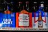 Six-packs of Bud Light, Budweiser and Michelob Ultra are displayed at a liquor store, Wednesday, Feb. 28, 2024, in Fairfield, Calif. (AP Photo/Godofredo A. Vásquez)
