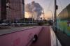 A man walks along an underpass as smoke rises following a Russian missile attack in Kyiv, Ukraine, early Tuesday, Sept. 8, 2026. (AP Photo/Francisco Seco)