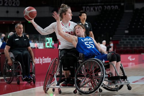 United States' Courtney Ryan (55) defends against Canada's Arinn Young during a women's wheelchair basketball quarterfinal at the Paralympic Games in Tokyo on Aug. 31, 2021. Young will compete in her fourth world championship when Canada hosts the tournament in Ottawa. THE CANADIAN PRESS/AP-Kiichiro Sato