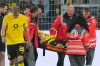 Dortmund's Konstantinos Karetsas is carried off the pitch by medical staff during the Champions League opening phase soccer match between Borussia Dortmund and Villarreal in Dortmund, Germany, Tuesday, Sept. 8, 2026. (AP Photo/Martin Meissner)
