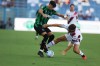 Sassuolo's Cristian Volpato, left, fights for the ball with Torino's Nikola Vlasic during the Serie A soccer match between Sassuolo and Torino, in Reggio Emilia, Italy, Saturday Aug. 29, 2026. (Gianni Santandrea/LaPresse via AP)