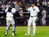 New York Yankees catcher Austin Wells, left, and pitcher David Bednar, right, shakes hands after defeating the Colorado Rockies, Tuesday, Sept. 8, 2026, in New York. (AP Photo/Noah K. Murray)
