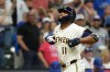 Milwaukee Brewers' Jackson Chourio gestures as he rounds the bases after hitting a two-run home during the ninth inning of a baseball game against the Chicago Cubs, Tuesday, Sept. 8, 2026, in Milwaukee. (AP Photo/Aaron Gash)