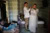 Liudmyla Ryzhak, right, and her fiancee Leonid Ryzhak get ready for their wedding ceremony in their damaged apartment, following a Russian missile and drone attack in Kyiv, Ukraine, Tuesday, Sept. 8, 2026. (AP Photo/Francisco Seco)