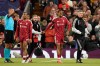 Liverpool's Bradley Barcola leaves the pitch injured during the Champions League opening phase soccer match between Liverpool and Atletico Madrid in Liverpool, England, Wednesday, Sept. 9, 2026. (AP Photo/Dave Thompson)