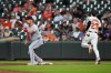 Baltimore Orioles' Blaze Alexander (23) is unable to beat the throw to Cleveland Guardians first baseman Nathaniel Lowe, left, during the third inning of a baseball game, Tuesday, Sept. 8, 2026, in Baltimore. (AP Photo/Stephanie Scarbrough)