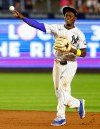 New York Yankees second baseman Jazz Chisholm Jr. throws out Colorado Rockies Cole Carrigg during the ninth inning of a baseball game, Tuesday, Sept. 8, 2026, in New York. (AP Photo/Noah K. Murray)