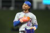 New York Mets shortstop Francisco Lindor (12) gestures during the eighth inning of a baseball game against the Miami Marlins Wednesday, Sept. 9, 2026, in Miami. (AP Photo/Marta Lavandier)