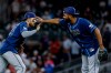 Tampa Bay Rays right fielder Victor Mesa Jr., left, celebrates with third baseman Junior Caminero, right, after defeating the Atlanta Braves during the ninth inning of a baseball game, Wednesday, Sept. 9, 2026, in Atlanta. (AP Photo/Erik S. Lesser)