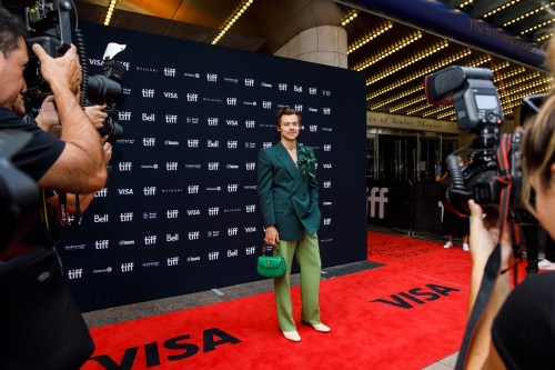 Harry Styles is photographed on the red carpet of The Princess of Wales Theatre for the film 
