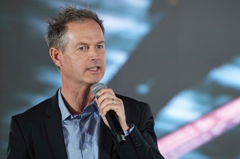 FILE - Edgar Grospiron, the head of 2030 Olympic Winter Games, delivers a speech during a news conference in Decines, France, Feb. 18, 2025. (AP Photo/Laurent Cipriani, File)