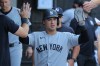 FILE - New York Yankees' Anthony Volpe celebrates in the dugout after scoring on Trent Grisham RBI single in the during the tenth inning of a baseball game against the Chicago White Sox, July 30, 2026, in Chicago. (AP Photo/Melissa Tamez, File)