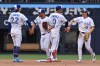 Members of the Toronto Blue Jays, from left, Ernie Clement, Myles Straw, Andres Gimenez and Brett Bateman, celebrate after a win over the Seattle Mariners in Major League Baseball action on Aug. 29, 2026. THE CANADIAN PRESS/Jon Blacker