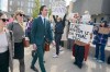 Alex Formenton passes protesters as he arrives at the courthouse in London, Ont. on Thursday, May 8, 2025. THE CANADIAN PRESS/ Geoff Robins
