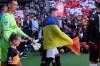 Shakhtar Donetsk players draped in Ukrainian flags enter the stadium before the Champions League opening phase soccer match between PSV Eindhoven and Shakhtar Donetsk in Eindhoven, Netherlands, Thursday, Sept. 10, 2026. (AP Photo/Patrick Post)