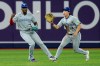 Toronto Blue Jays center fielder Brett Bateman, right, fields a single in front of right fielder  Jesus Sanchez by Tampa Bay Rays' Cedric Mullins during the fourth inning of a baseball game Tuesday, Aug. 18, 2026, in St. Petersburg, Fla. (AP Photo/Chris O'Meara)