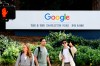 People wait to cross a road at Google headquarters on Thursday, March 26, 2026, in Mountain View, Calif. (AP Photo/Noah Berger)