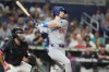 Los Angeles Dodgers' Kyle Tucker (23) follows through on a grand slam during the seventh inning of a baseball game against the Miami Marlins, Friday, Sept. 11, 2026, in Miami. (AP Photo/Lynne Sladky)