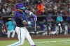 Arizona Diamondbacks' Ketel Marte connects for a two-run double against the Texas Rangers during the fifth inning of a baseball game, Friday, Sept. 11, 2026, in Phoenix. (AP Photo/Ross D. Franklin)