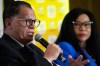 FILE - Danny Jordaan, South African soccer association president, left, speaks during a joint media briefing in Johannesburg, South Africa, on July 5, 2023. (AP Photo/Themba Hadebe, File)