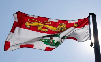 The Prince Edward Island provincial flag flies on a flag pole in Ottawa, Friday, July 24, 2026.  THE CANADIAN PRESS/Adrian Wyld