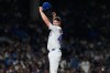 Chicago Cubs relief pitcher Trent Thornton wipes his face after Cincinnati Reds' Sal Stewart hit a solo home run during the seventh inning of a baseball game in Chicago, Sunday, Aug. 30, 2026. (AP Photo/Nam Y. Huh)