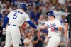 Los Angeles Dodgers' Will Smith, right, is congratulated by Freddie Freeman after hitting a solo home run during the first inning of a baseball game Tuesday, Sept. 8, 2026, in Los Angeles. (AP Photo/Mark J. Terrill)