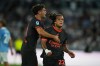 AC Milan's Diego Moreira, right, celebrates after he scored his side's second goal with his teammate Christian Pulisic during a Serie A soccer match between Lazio and AC Milan, in Rome, Saturday, Sept. 12, 2026. (AP Photo/Alessandra Tarantino)