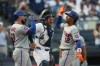 New York Mets' Francisco Lindor (12) high-fives Luis Torrens (13) after he hit a grand slam during the eighth inning of a baseball game against the New York Yankees, Saturday, Sept. 12, 2026, in New York. (AP Photo/Heather Khalifa)