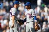 New York Mets' Jared Young (29) and Francisco Lindor (12) come together following a win over the New York Yankees after the ninth inning of a baseball game, Saturday, Sept. 12, 2026, in New York. (AP Photo/Heather Khalifa)