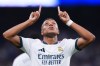 Real Madrid's Kylian Mbappe celebrates scoring his side's 4th goal during the Spanish La Liga soccer match between Real Madrid and Rayo Vallecano in Madrid, Spain, Saturday, Sept. 12, 2026. (AP Photo/Manu Fernandez)