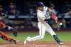 Tampa Bay Rays' Nick Madrigal connects for a run scoring sacrifice fly off Houston Astros pitcher Bennett Sousa during the seventh inning of a baseball game Saturday, Sept. 12, 2026, in St. Petersburg, Fla. (AP Photo/Chris O'Meara)
