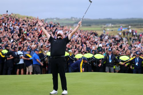 Shane Lowry of Ireland celebrates winning the Irish Open at Trump International Golf Links in Doonbeg, Ireland, Sunday, Sept. 13, 2026.(AP Photo/Peter Morrison)